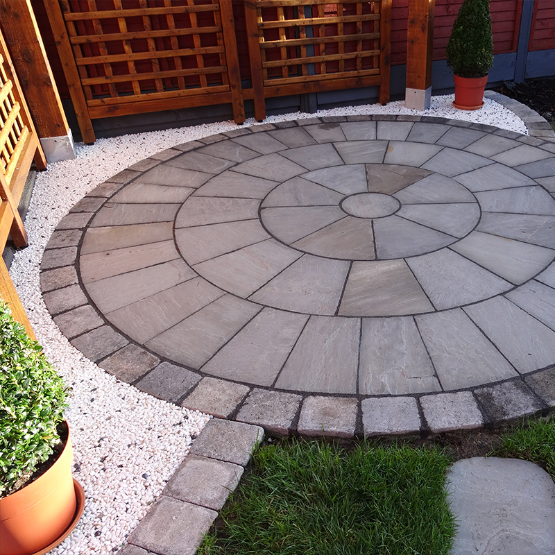 Michael planning the layout for his sandstone paving circle patio